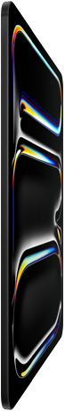 iPad Pro, front exterior, space black colour, aluminum and glass enclosure, thin profile, tilted back with display showing multicoloured line art
