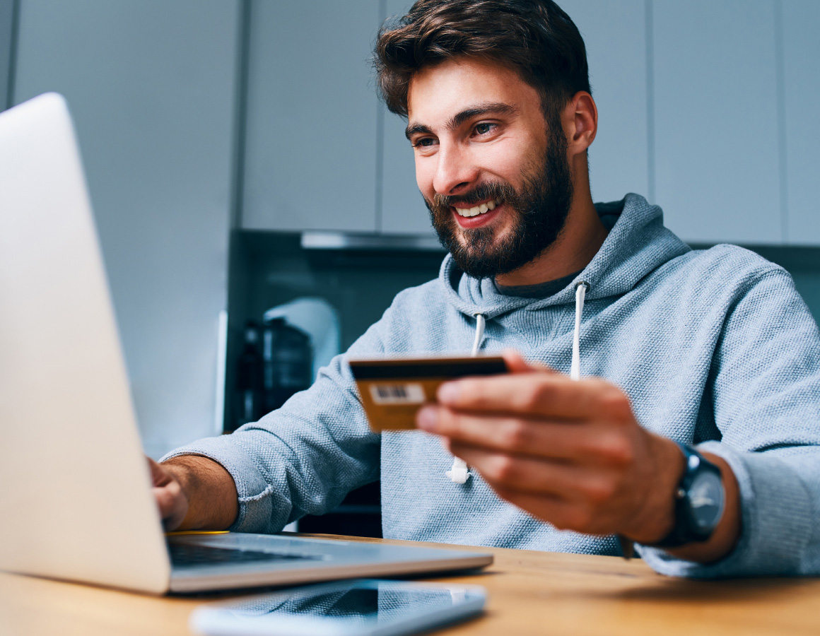 person making a purchase on their computer