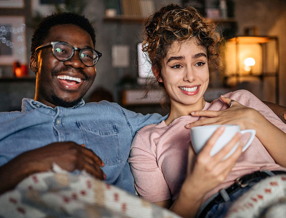 a man and woman watching TV 