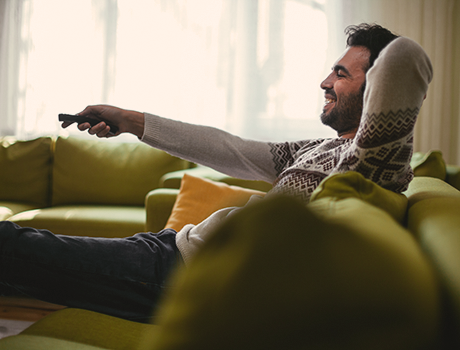 a man watching TV