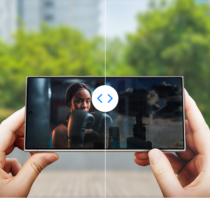Video with clear visibility is portrayed in a before and after style comparison a Galaxy S24 Ultra display. The device is being held outside in the daylight and a video is playing on the screen.