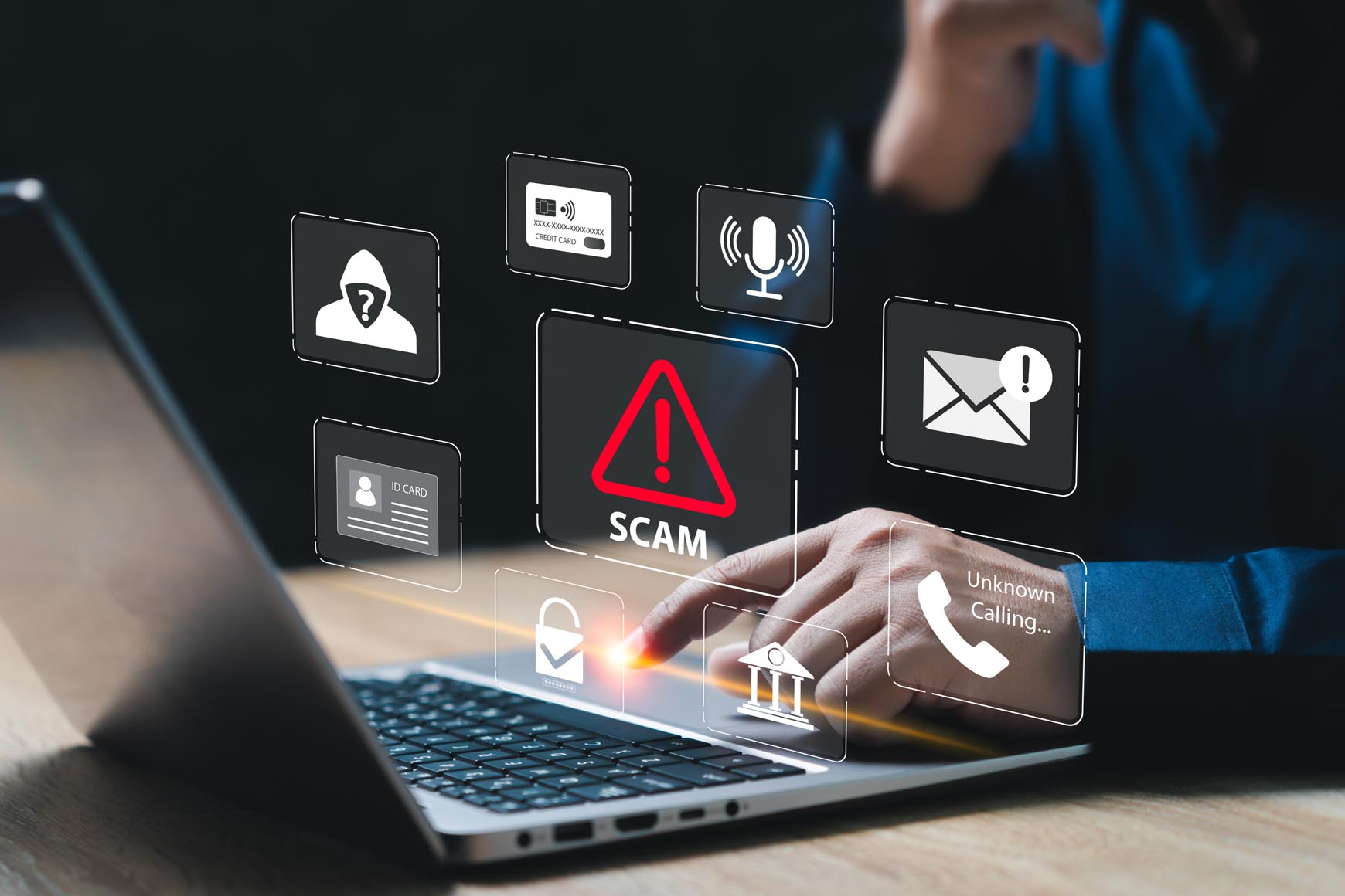 man on computer with icons on the screen describing a cyber attack