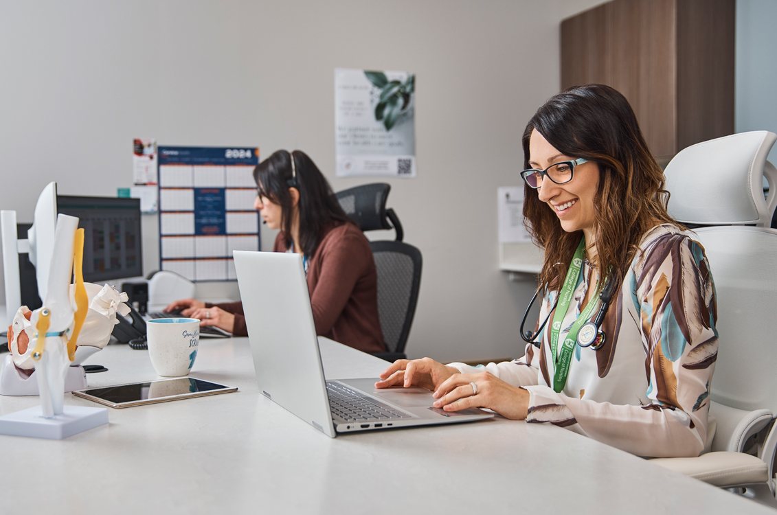 Medical coworkers working at their computers
