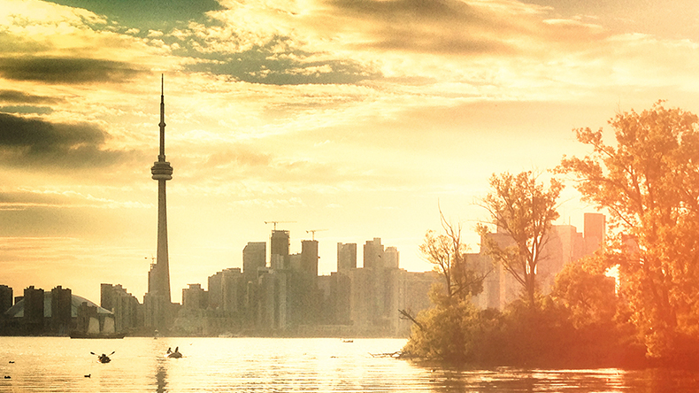 Sunrise in Toronto, a hazy picture of the CN Tower and the city skyline Sunrise in Toronto, a hazy picture of the CN Tower and the city skyline